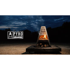 Pyro Tower chiminea at night beside the PYRO sign