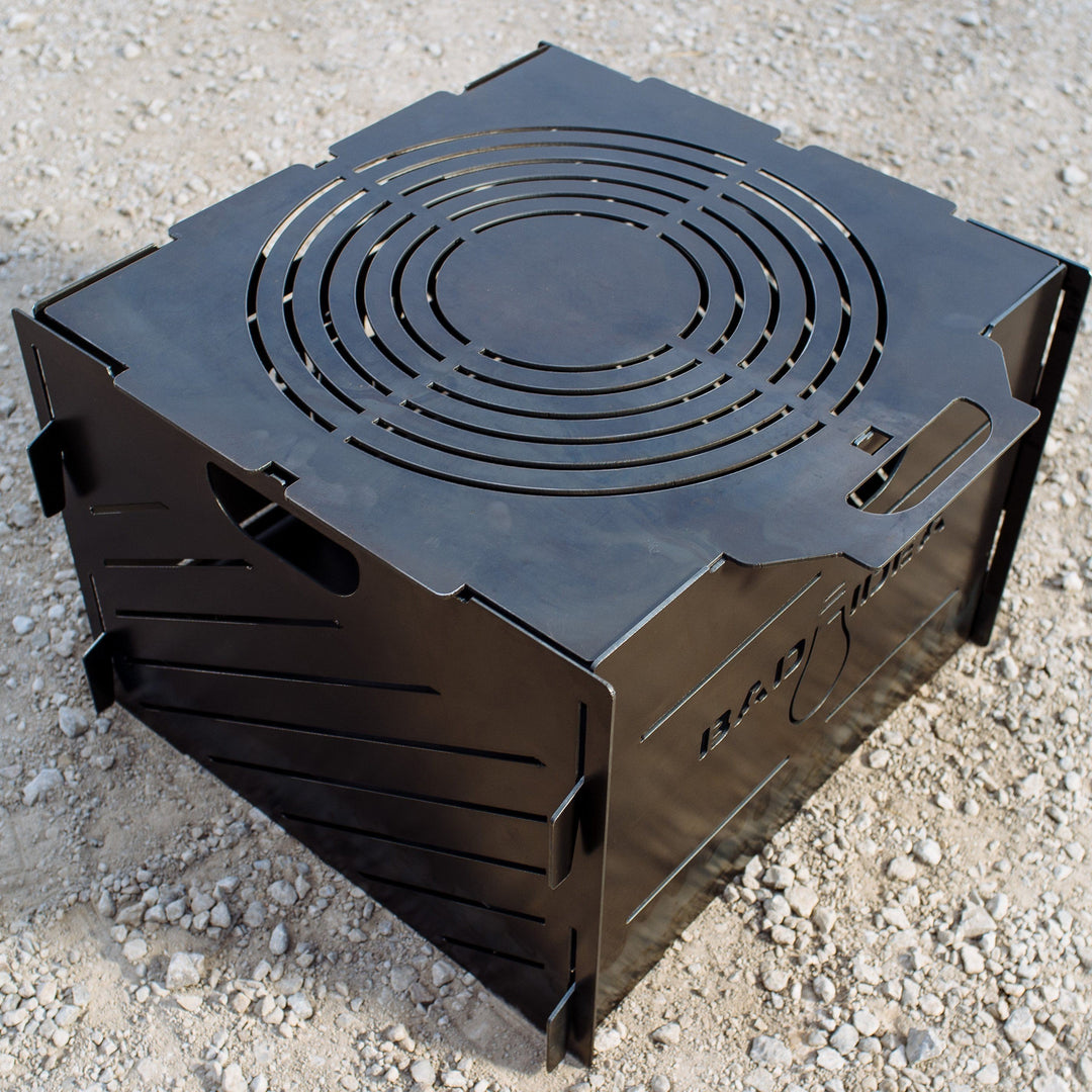 PYRO Small Burn Cage (16") with included lid and riser base — studio view
