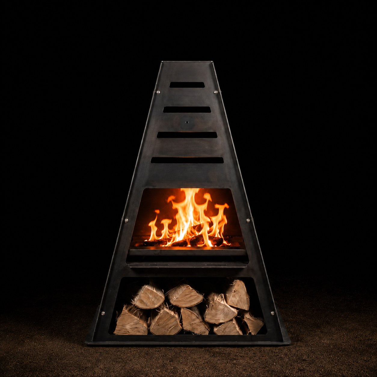 Pyro Tower Basic Kit — chiminea with fire shelf and firewood rack, studio view