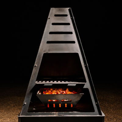 Pyro Tower Charcoal Grill Kit — grill grate and glowing charcoal basket, studio view